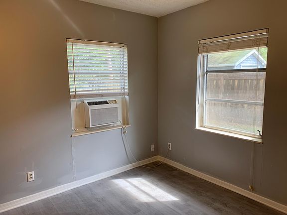 Bedroom with extra air conditioner.