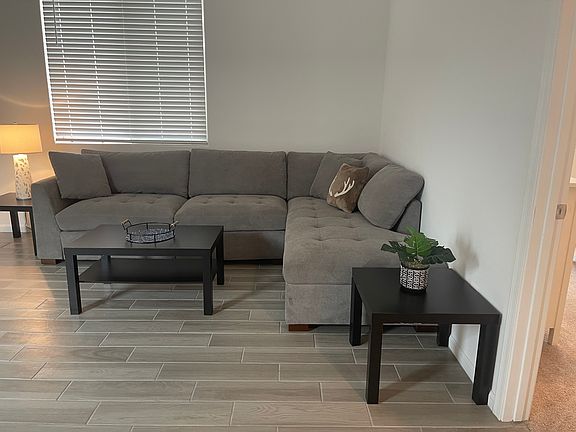Living space, large TV and kitchen table