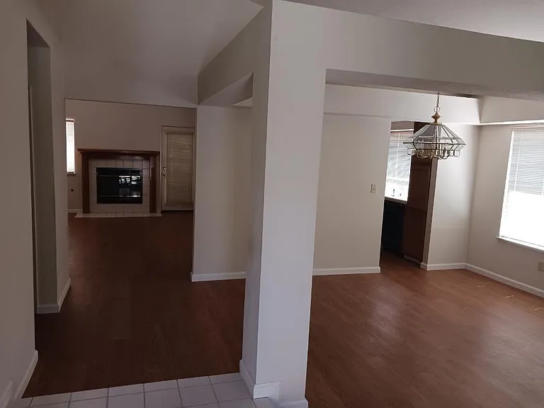 Formal dining area/entrance to kitchen and second living room area.