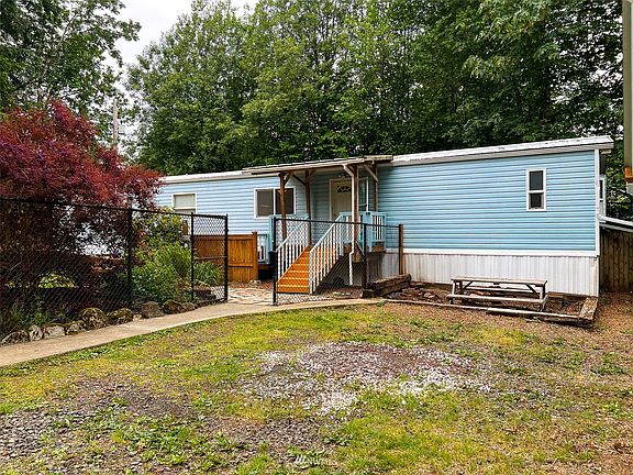 Fully fenced and gated front yard.  Covered porch.>