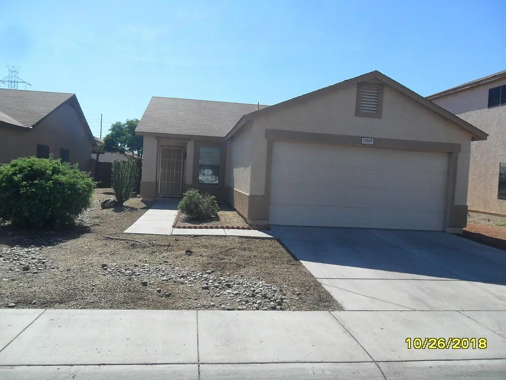 El Mirage Home with Tile Flooring Throughout — Photo 1