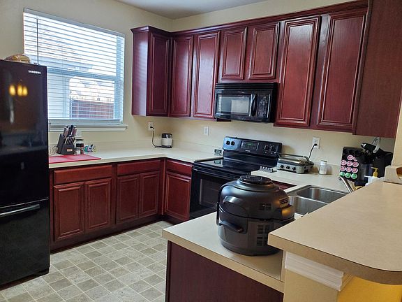 Plenty of cabinet and counter top space in this bright open kitchen