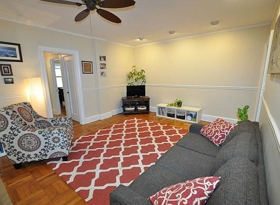 Large Living Room overlooking Garth Woods and the buildings patio.  The living room has recess lighting, chair rail and refinished parquet floors.  The room is 23'-0" x 14'-0".