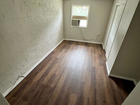 bonus room with wood floors and closet