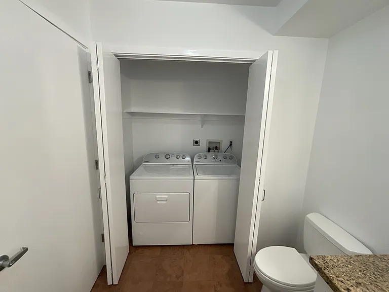Laundry closet is located in the 1/2 bath on the main floor.
