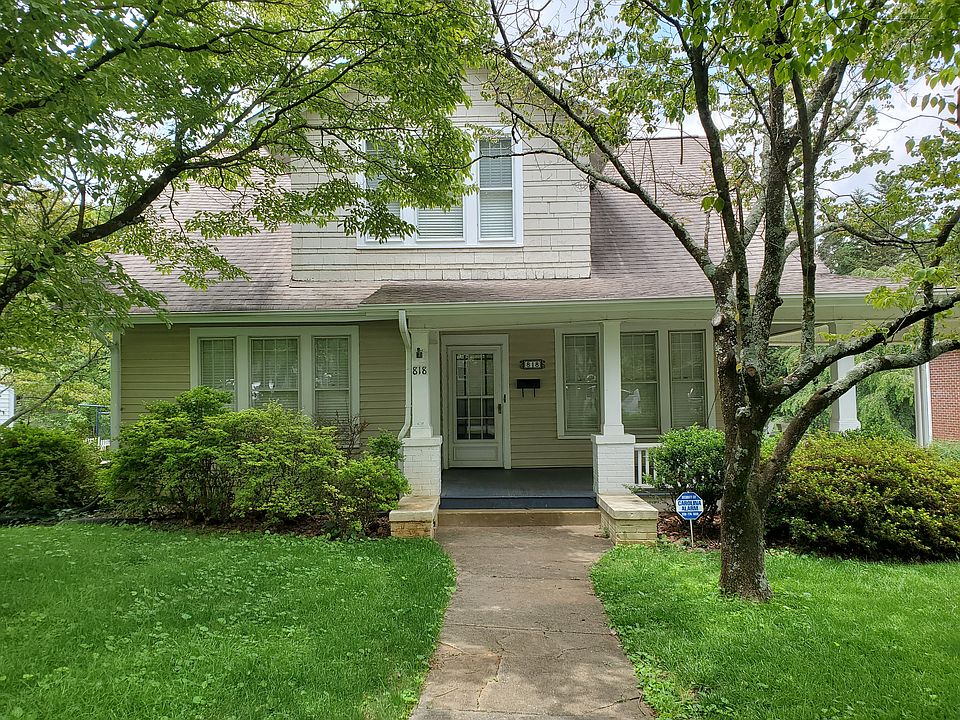 Front of home with porte cochere