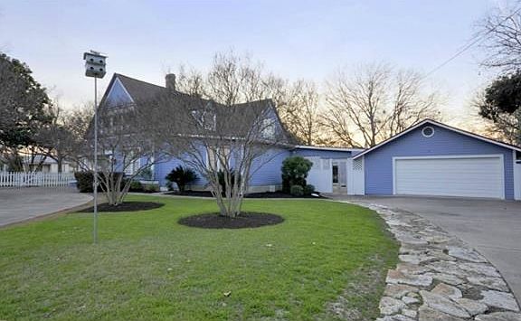 side view with detached garage used as game room and can be converted back to garage