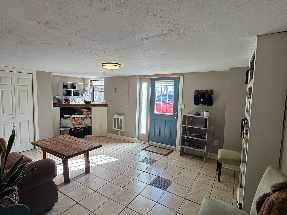 Living room/front entrance from the hallway.