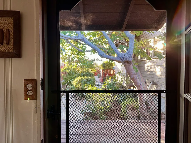 Front screen door keeps bugs out and breeze in