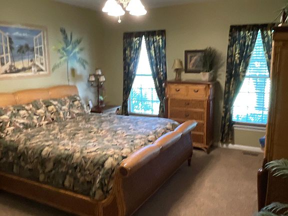 Master bedroom with king bed, smart TV, walk in closet.