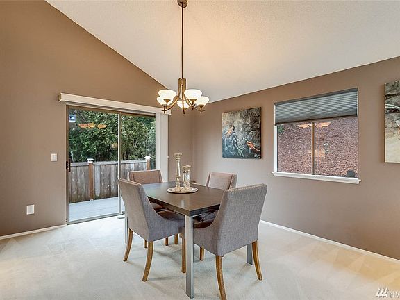 Formal dining room with sliding glass door that leads to a recently updated deck and patio. 