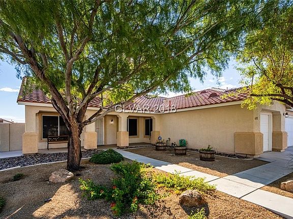 Front yard, with side gate for easy rear yard access. Covered front porch creates a relaxing spot to sit.