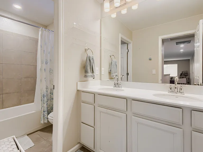 Upstairs bathroom with a partition between the bath/toilet and double vanity! Perfect for a busy family in the mornings!