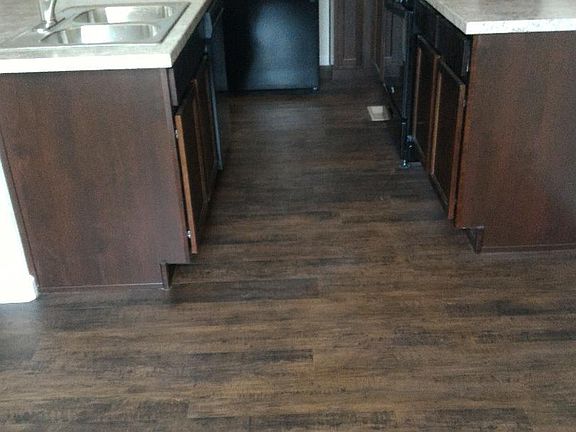 Kitchen: Excellent Hardwood dark color floor!