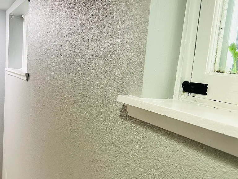 Wall as you enter the unit