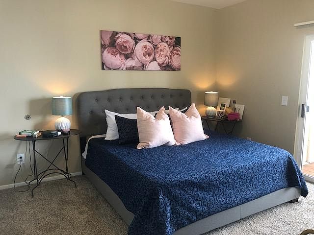 Spacious bedroom with doors to the deck and large walk-in closet.