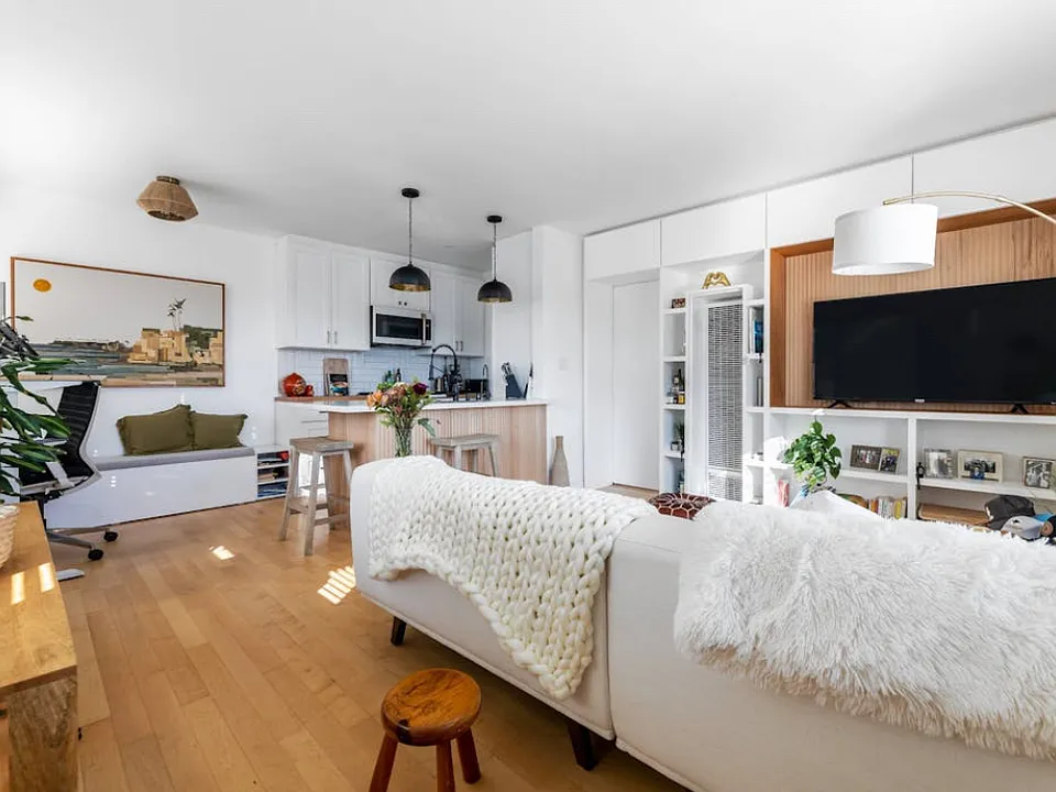 Your well-lit open kitchen and living room.
