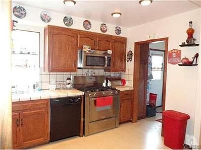 Kitchen with Laundry through doorway.