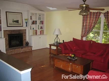 Family Room (21 x 14) : Wood Floor, Fireplace, Skylights & Built-in Book Shelves & Cabinets. Wood vi