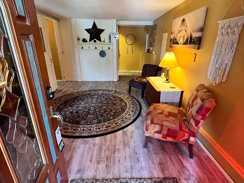 Shared "lobby area". Our entrance is to the left and upstairs. Apartment entrance is to the right of the star on the wall. Laundry room for apartment is to the left of the front door.