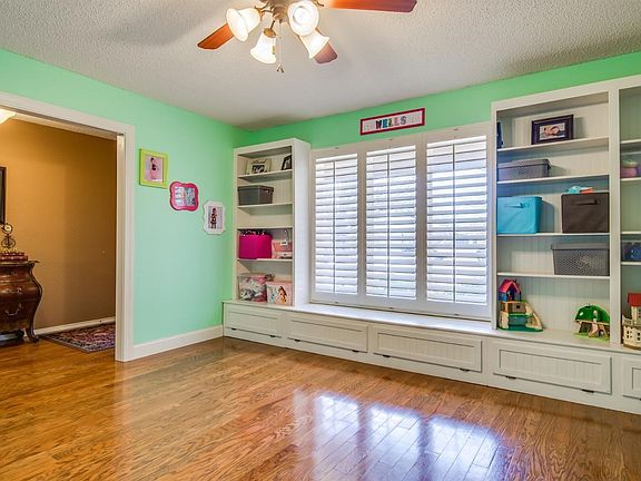 Dining room is currently being used as a playroom.  Custom shelving and storage!
