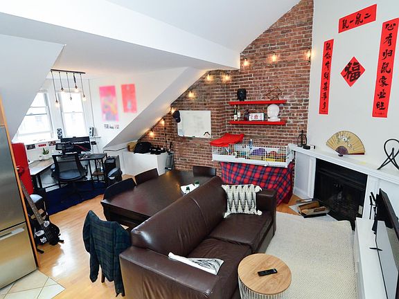 Spacious living room with working fireplace