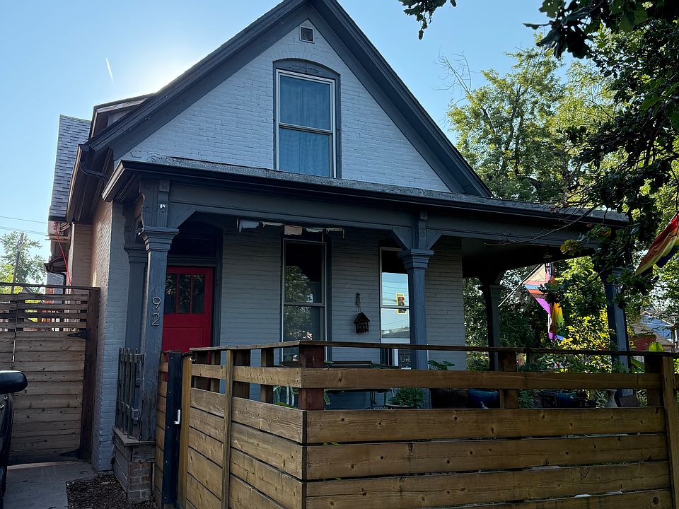 Front door, parking spot (to the left) and front porch