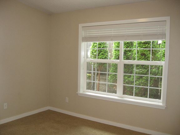 Nice sized bedroom with large window open to patio