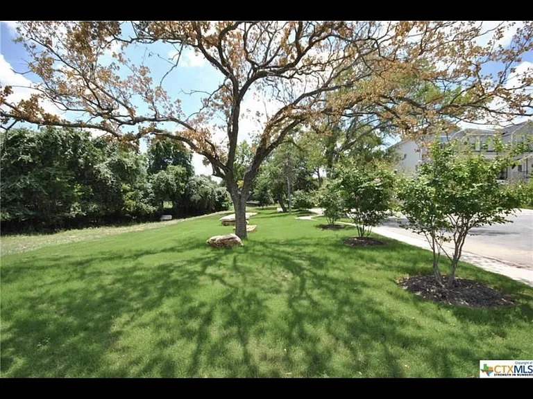 Side yard by this corner unit. Great play yard