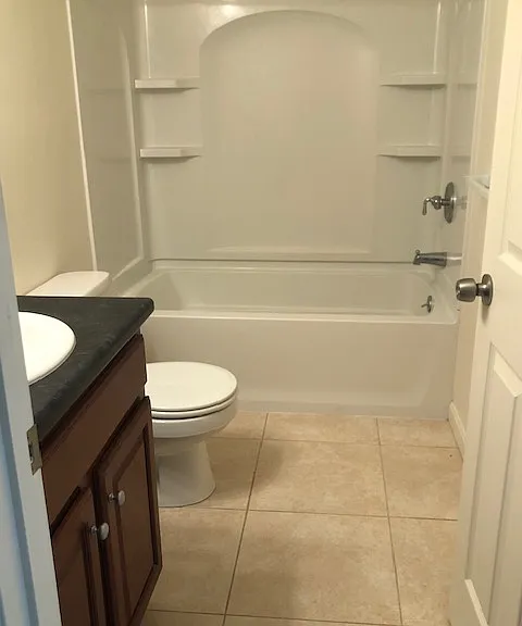 Full second floor bathroom with tile flooring that is clean, functional, and easy to maintain.