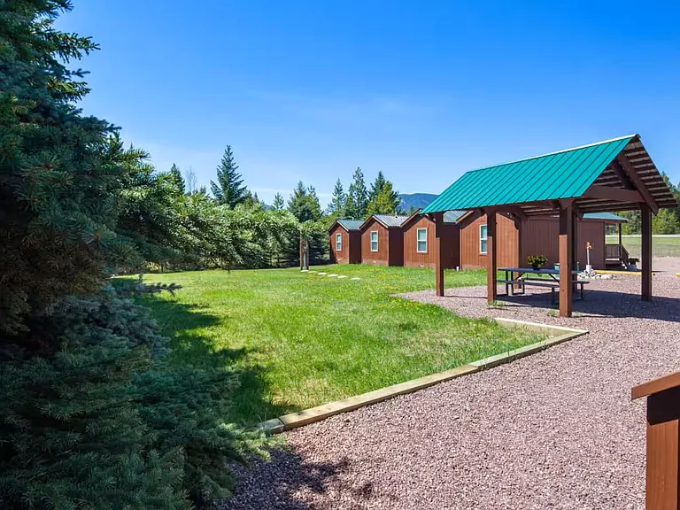 Grass area behind cabins