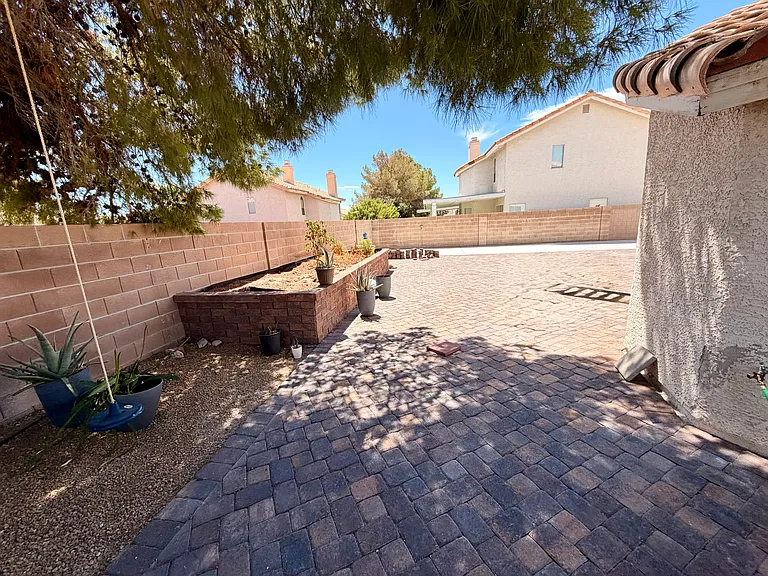 Backyard looking towards raised garden, RV parking.