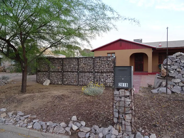 Front of home faces north and has a covered porch.