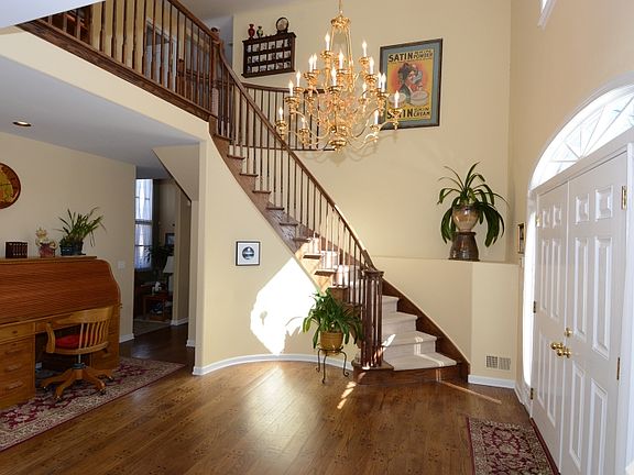 Dramatic Entry Foyer with Sweeping Staircase