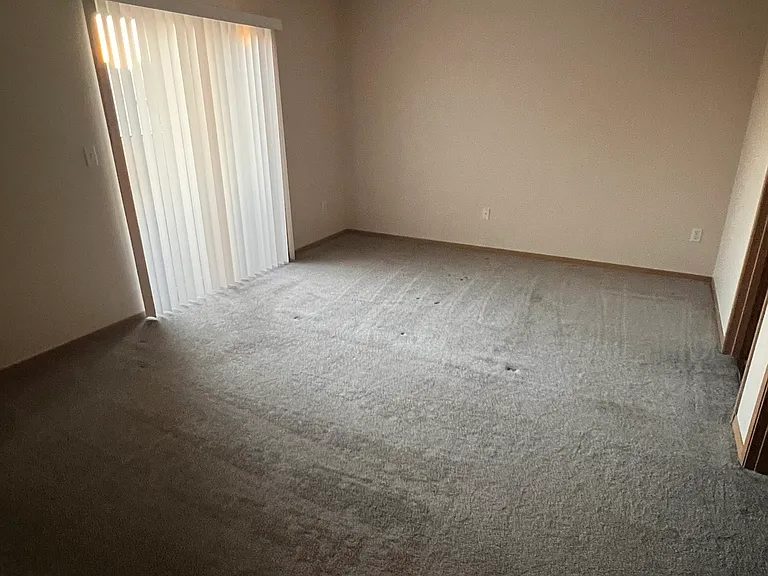 master bedroom, sliding door to deck on left, doors to full bath and walk-in closet on the right