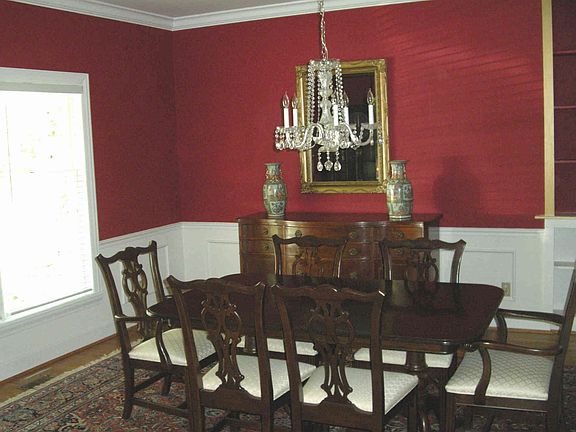 Formal dining room with crown molding, chair rail, hardwood floor
