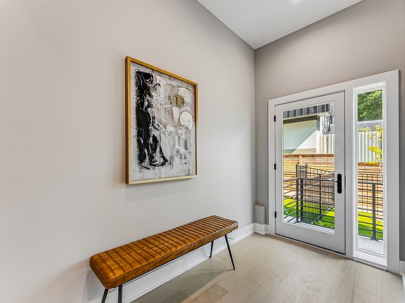 Front door looking out to private fenced yard