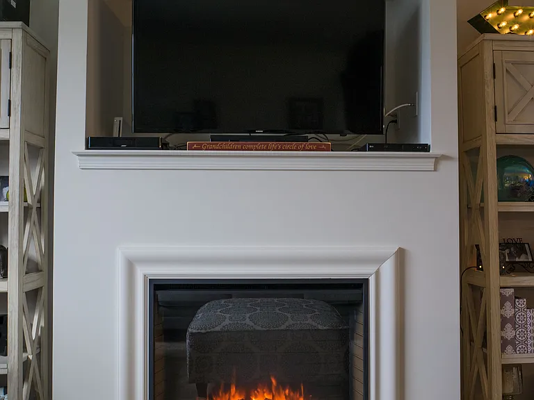 Electric fireplace in select units
