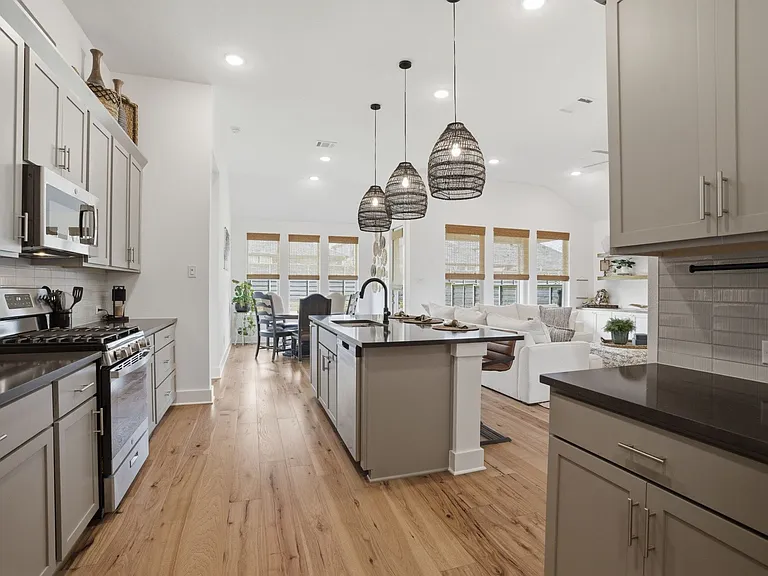 An extra set of cabinets & counter space (shown on right) makes an ideal coffee or wet bar.