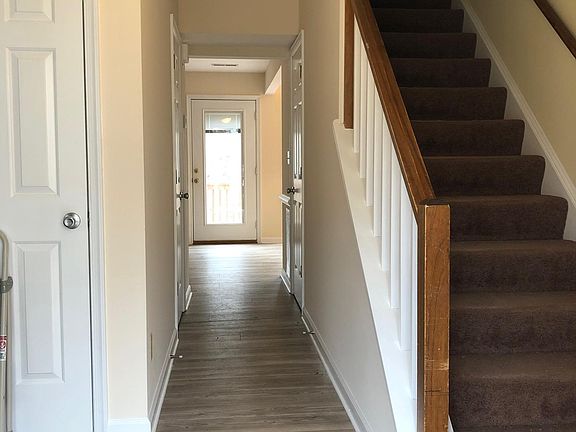 Main hallway. Straight ahead is the family room. To the right is the dining room. To the left is the family room.