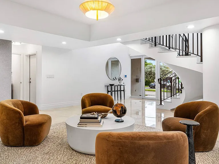 Intimate nook with soft upholstery and natural stone flooring, perfect for quiet moments.