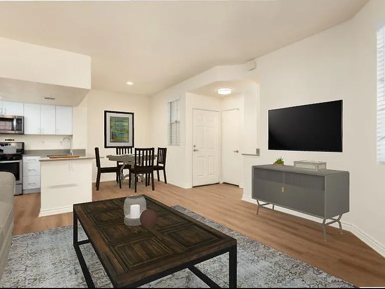 Renovated Package I living area with hard surface flooring