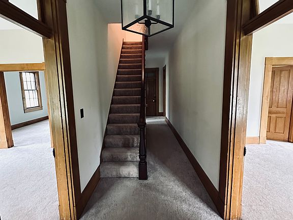 Entry Hallway. Bed room to the right. Living room to the left. Upstairs to 2 bedroom