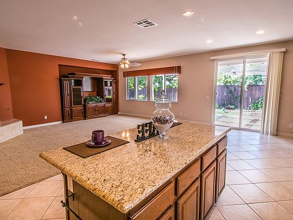View from kitchen into family room. Custom-built wall unit.