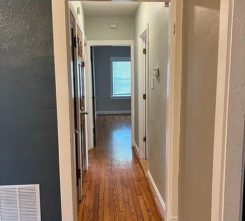 Hallway to bathroom and 2 bedrooms