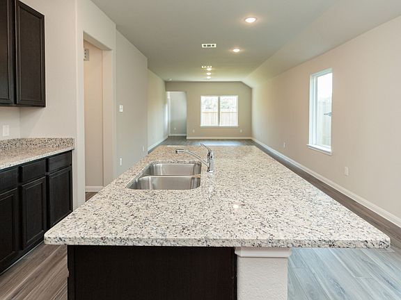Kitchen to Dining Area and Family Room
