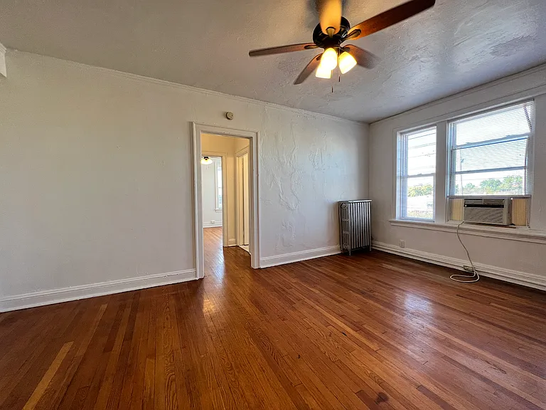 Looking from kitchen area into hallway and bedroom.