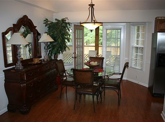 Dining room set with bay area entrance to Screened in porch