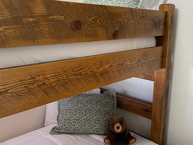 Small bedroom with twin bunk over double.