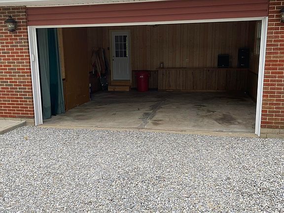 looking into attached garage and main door entry door to house